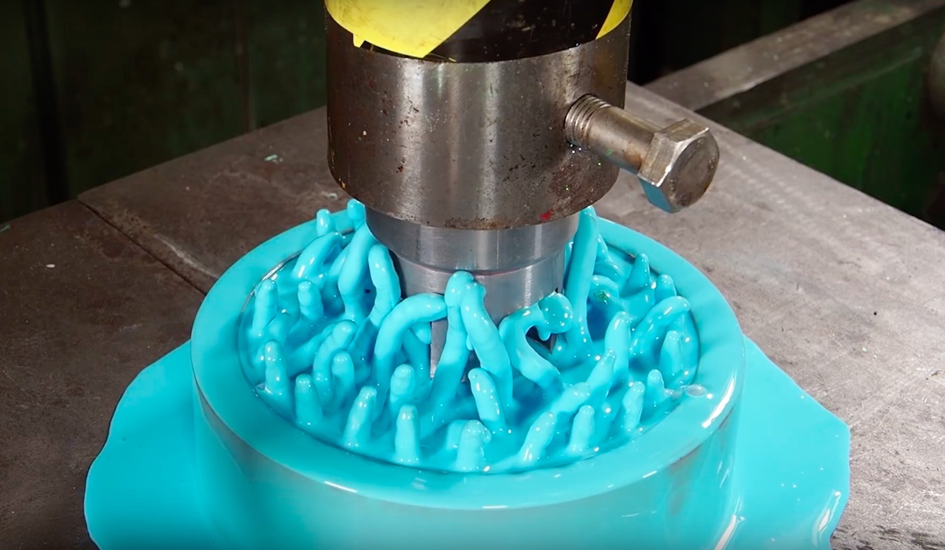Hydraulic Press Pushes NonNewtonian Fluid Through a Plate Drilled With
